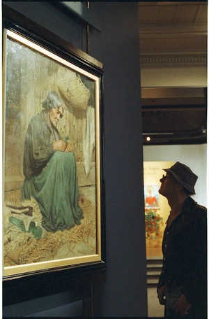 Visitor views Goldie's painting The Widow at the National Art Gallery, Wellington - Photograph taken by Mark Coote