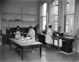 Workers preparing meals for unemployed women and girls