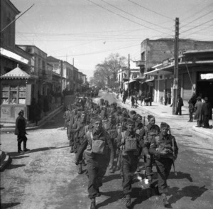 2nd NZEF soldiers marching through a Greek town