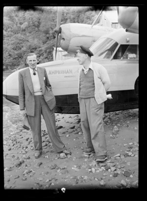Two unidentified men beside Amphibian Airways Ltd seaplane Invercargill
