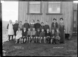 Pupils and staff at Te Uku Public School, 1910 - Photograph taken by Gilmour Brothers