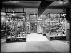 Shop windows and entrance to McGruer's store in Devon Street, New Plymouth