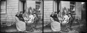 Women having tea outside the house of William and Lydia Williams in Napier