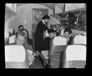 National Airways Corporation (NAC) stewardess in aircraft at Whenuapai, Auckland Region