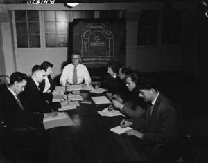 Members of the Inland Revenue Department at a meeting table - Photograph taken by Edward Percival Christensen