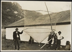 Creator unknown :Photograph of men with fishing net