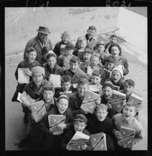 Boys selling programmes at a rugby match at Athletic Park, Newtown