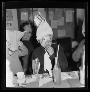 Unidentified National Airways Corporation Orphan wearing a party mask and hat