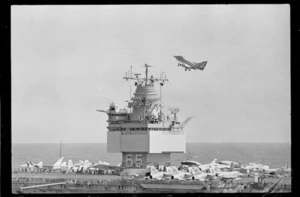 Aircraft carrier Enterprise with Skyhawk flying above