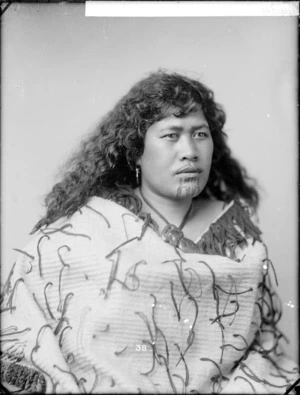Unidentified Maori woman wearing a tag cloak - Photograph taken by William Henry Thomas Partington