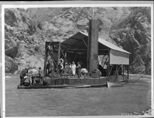 Group on board a gold dredge near Skippers, Queenstown