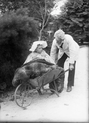 Young woman in a wheelbarrow