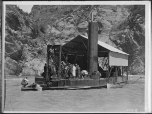 Creator unknown :Photograph of a group on board a gold dredge near Skippers, Queenstown