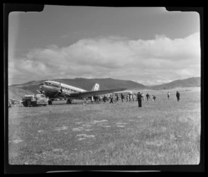 South Pacific Airlines of New Zealand (SPANZ) plane surrounded by a crowd of people at Alexandra, Otago Region