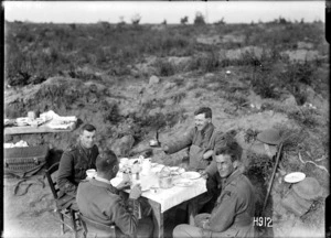 New Zealand officers eating breakfast in captured German trenches