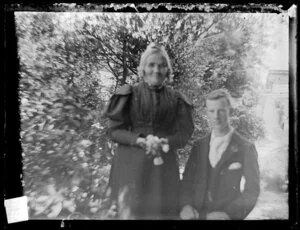 Sarah Jane Kirk and unidentified young man in garden