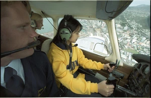 Eugenie Huang learning to fly an aeroplane - Photograph taken by Maarten Holl