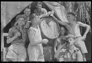 New Zealanders grouped about a cask of wine at the 24 Battalion swimming sports in Arce, Italy - Photograph taken by George Frederick Kaye