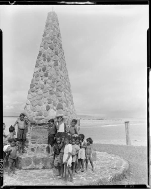 Children in front of memorial to the Arawa Canoe, Maketu - Photograph taken by Mr W Walker