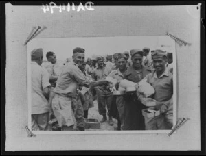 Members of 28 (Maori) Battalion in line for patriotic parcels, near Tripoli - Photograph taken by Dr C N D'Arcy