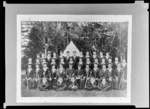 Group portrait of King's College students in [Sea Scout? Cadet?] uniforms with tent in the background