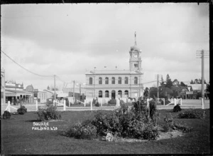 View of the post office at Feilding, looking across gardens in the centre of The Square