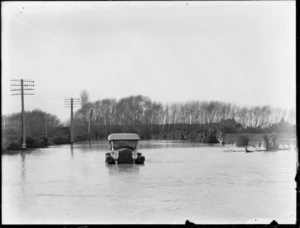 Car surrounded by flood waters