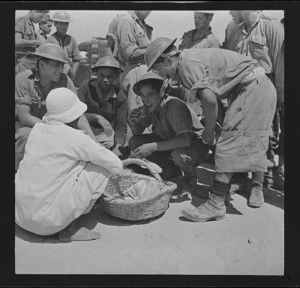 Members of the Maori Battalion sampling food, during World War II
