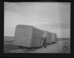 Maori Battalion trucks at side of road during World War II