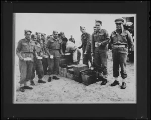 Members of 28 (Maori) Battalion getting Christmas Dinner at Headquarters, Nofilia, Libya - Photograph taken by Dr C N D'Arcy