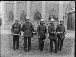 Members of the Christchurch Firebrigade with fire hose