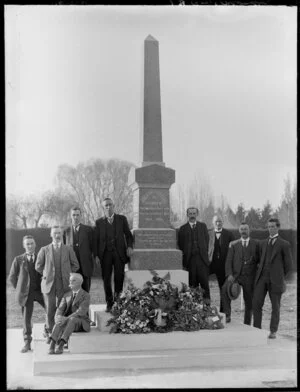 Unidentified group standing next to monument in memory of the Burwood boys, who died in World War 1914 - 1918