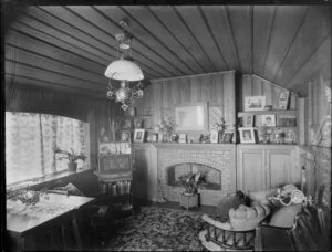 Interior of a house at Sumner, Christchurch, with hanging lamp and furnishings