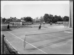 Girls playing tennis, St Margaret's College, Christchurch