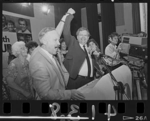 Finance Minister Roger Douglas holds up Prime Minister David Lange's arm in a victory salute - Photograph taken by Ross Giblin