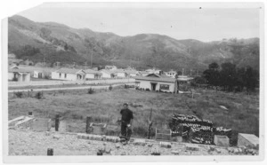 Man building a kiln, and houses, Upper Hutt, Wellington