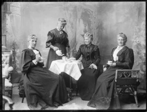 Studio photograph of ladies taking afternoon tea