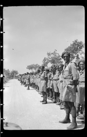 Members of 28 (Maori) Battalion lining the roadside for the visit of Winston Churchill, Italy - Photograph taken by W Brodie