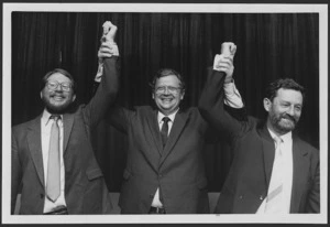 Prime Minister David Lange holds up the hands of David Robinson and Reg Boorman in victory