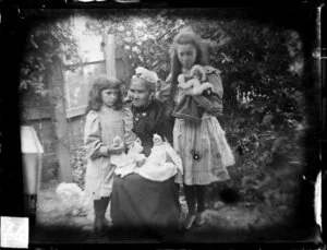 Sarah Jane Kirk with two girls with dolls