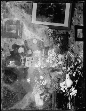 Interior with hebe, primula, daffodils on dresser