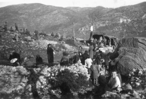 Guthrie, Bruce, fl 1939-1945 : Italian women and children waiting for food alongside the 26th Battalion cookhouse, Mount Croce area, Italy