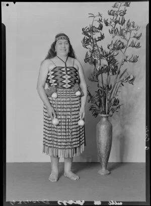 Probably Mrs M Clark, in traditional Maori clothing