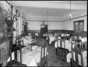 Interior of tearooms, North Brighton, with tables set for tea