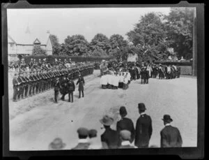 Ceremony at Christ's College, Christchurch, including school cadets at attention, and choirboys in the rear of a procession