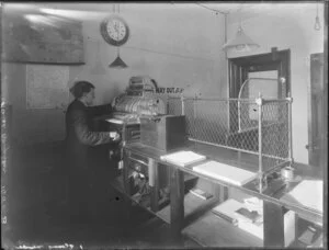 National Cash Register in use by unidentified man, possibly in Post Office