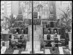 Window display of Gargoyle and Vacuum Spraying Oil for fruit trees and plants