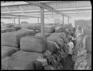 Buyers examining wool bales in store, Christchurch
