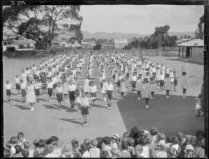 Large school group on parade in the school grounds, probably Hastings