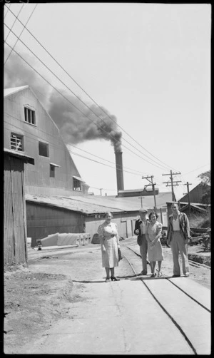 Group in front of buildings at Tarakohe Cement Works, Tasman District
